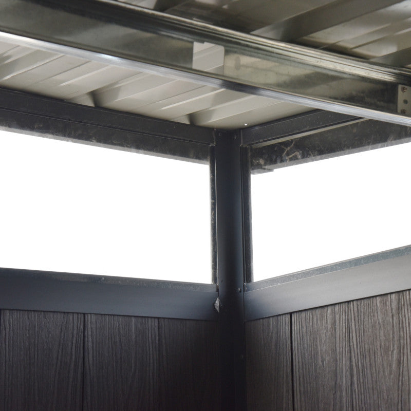 Close-up of a metal frame with glass panels on a white background garden shed
